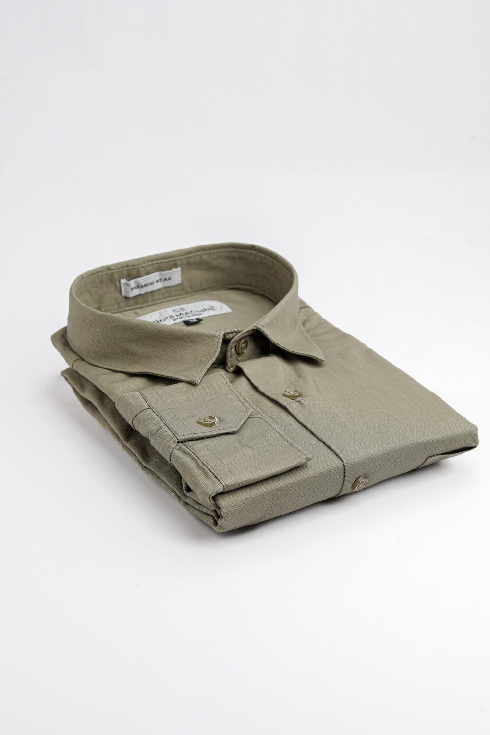 Folded Olive Green colour Rodi Machine shirt on a white background