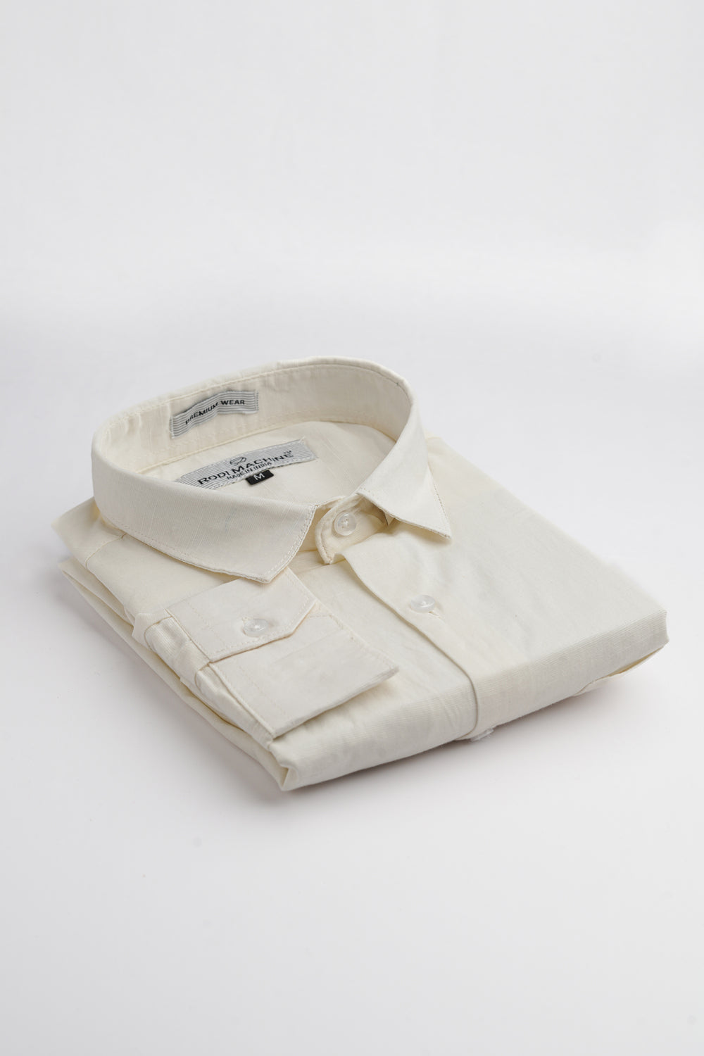 Folded Milky White colour Rodi Machine shirt on a light gray background